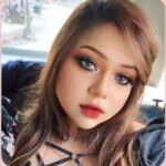 Beauty portrait with soft glam makeup, defined eye makeup, and rosy lips in natural light.